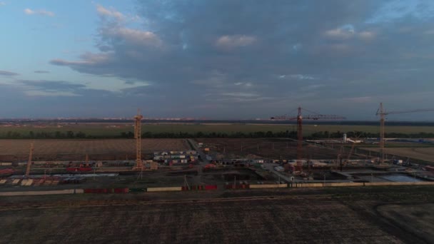 Industrial construction cranes in the field. — Stock Video