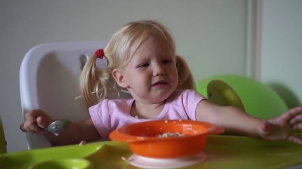 Moody child does not want to eat. The child refuses to eat. — Stock Video