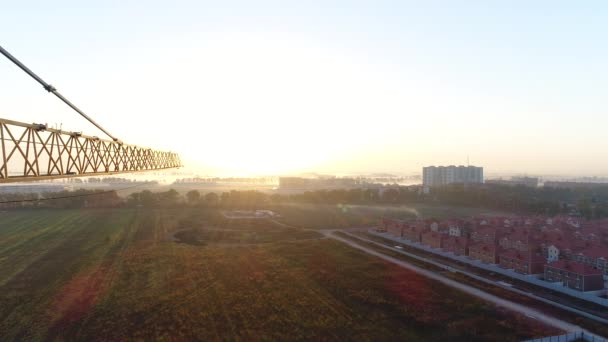 Krasnodar, Russian Federation - October 8, 2018: construction crane against the dawn of the sun. — Stock Video