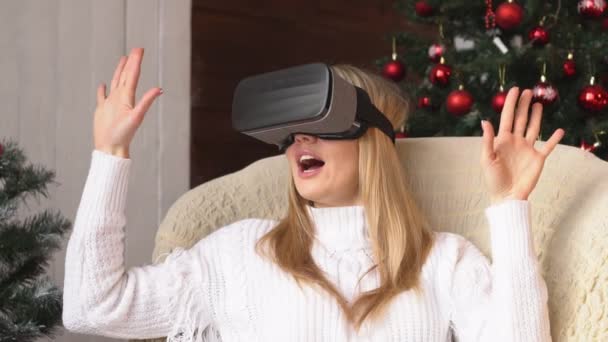 Young Blonde Woman Wearing Virtual Reality Glasses Christmas Slow Motion — Stock Video