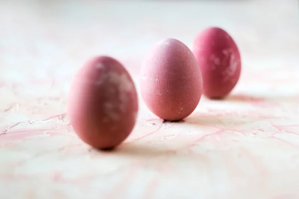 Pink easter eggs on the pink background.