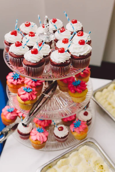Beautiful wedding cake and cupcakes