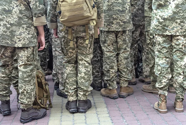 Soldiers in pixel camouflage uniforms