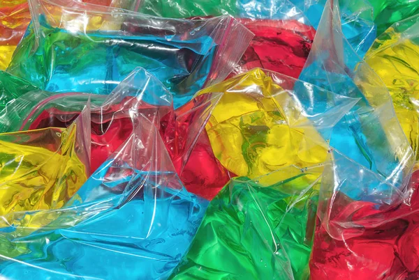 Sacchetti di plastica pieni di liquido colorato — Foto Stock