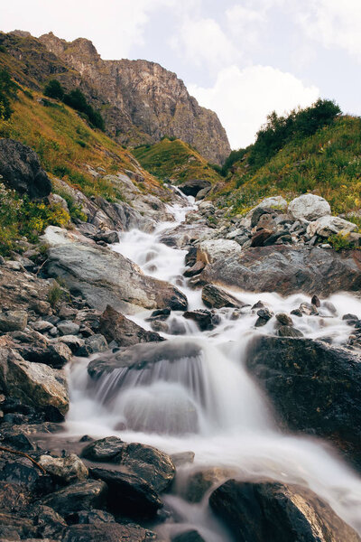 Mountain waterfall in Georgia moody summer day.