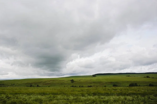 rainy sky clouds over agricultural rural landscape