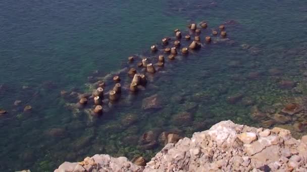 A breakwater built from concrete tetrapods. — Stock Video