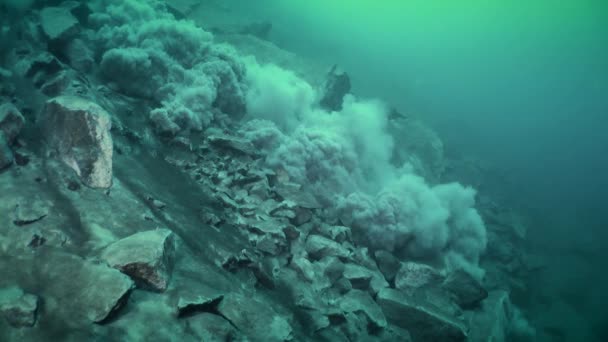 Underwater collapse on a rocky slope, wide shot. — Stock Video