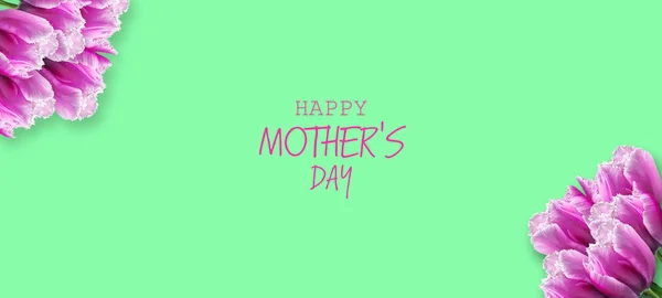 Glücklicher Muttertag. schöne Tulpen auf grünem Hintergrund. Kopierraum. Grußkarte. Festbanner. — Stockfoto