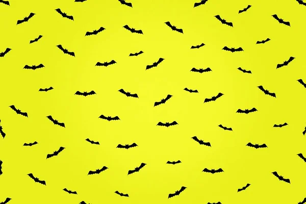 Feliz Halloween de fondo. Un montón de iconos de murciélagos sobre un fondo amarillo. Fondo festivo . —  Fotos de Stock