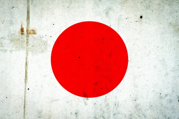 コンクリートの壁に日本の旗 旅行だ — ストック写真
