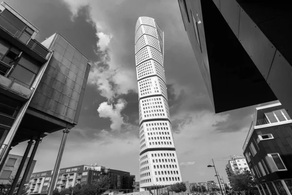 Malmo. Sweden. July 29. 2019. Turning Torso, a beautiful skyscraper against a cloudy sky.Black and white photo. Architecture Attractions