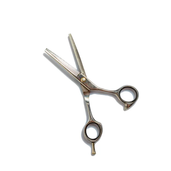 Thinning barber scissors isolated on white background. Beauty and fashion. The objects