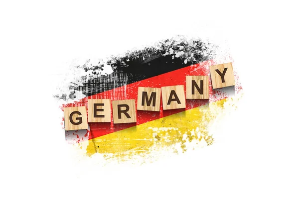Duitsland Opschrift Houten Blokken Tegen Achtergrond Van Vlag Van Duitsland — Stockfoto