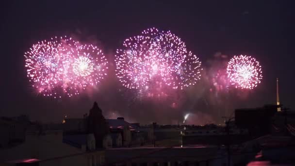 Fireworks and light show at night View from building roof Celebration holidays — Stock Video