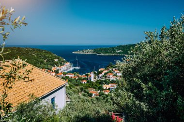 Greece, the island of Ithaca Ithaki. Stunning view of the remote Mediterranean town, olive groves and blue sea bay. Vacation in Greece, summer time clipart