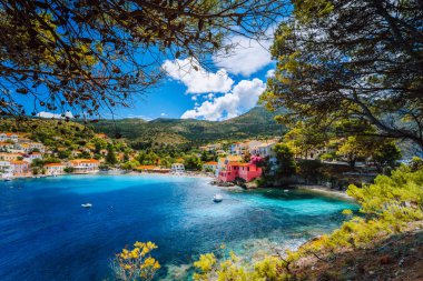 Beautiful blue bay in Assos village located on Kefalonia. Summer tourism vacation trip around Greece clipart