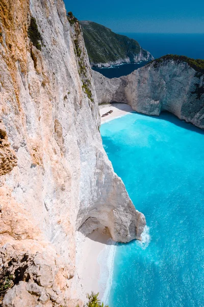 Limestone chalk colored like huge cliff rocks surrounding Navagio beach with Shipwreck and azure blue sea water. Zakynthos island, Greece — Stock Photo, Image