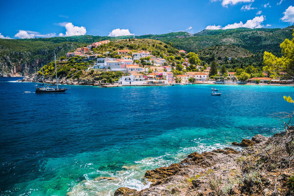 Beautiful blue bay in Assos village located on Kefalonia. Summer tourism vacation trip around Greece