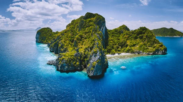 Aerial drone panorama view of tropical paradise island. Karst limestone rocky mountains surrounds by blue ocean and coral reef — Stock Photo, Image