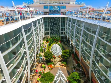 Cape Canaveral, USA - April 29, 2018: The central park at cruise liner or ship Oasis of the Seas by Royal Caribbean clipart