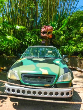 Orlando, Florida - May 09, 2018: Jurassic Park dinosaur and jeep at Universal Studios Islands of Adventure theme park clipart