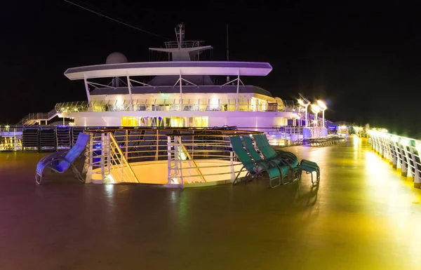 Cape Canaveral, USA - May 06, 2018: Open deck in the night time. Giant cruise ship Oasis of the Seas by Royal Caribbean. — Stock Photo, Image