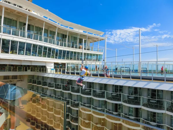 Cape Canaveral, USA - April 29, 2018: The passenger flying at zip line at cruise liner or ship Oasis of the Seas by Royal Caribbean — Stock Photo, Image