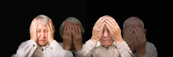 Portrait of an elderly man and woman with face closed by hands