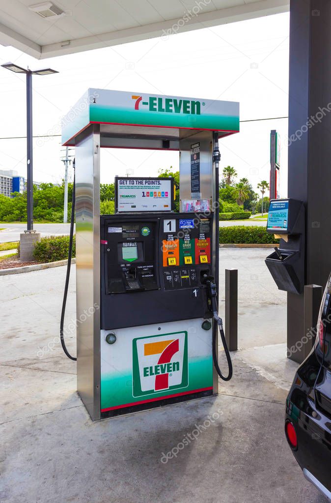 Orlando, USA - May 8, 2018: Filling nozzles at 7-Eleven gas station at Orlando, USA on May 8, 2018. 7-Eleven is an multinational oil and gas company and service stations