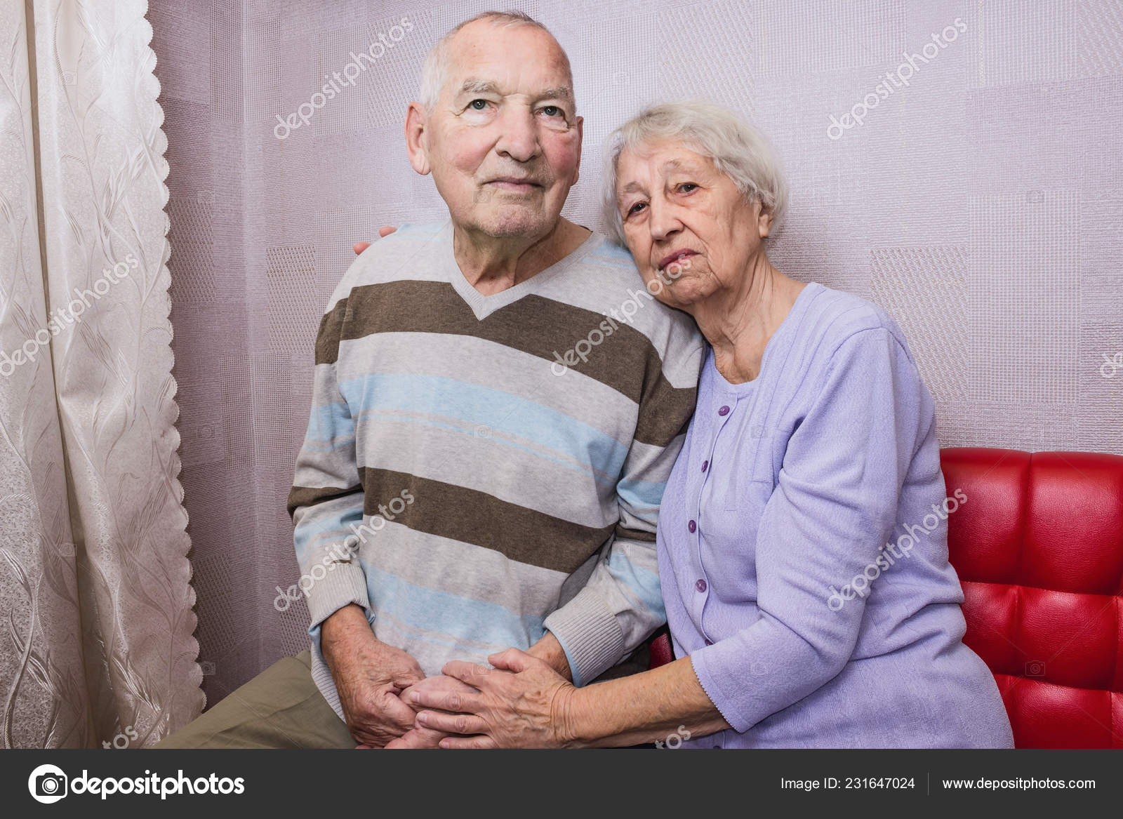 Happy Affectionate Mature Old Man And Woman Embracing Looking At