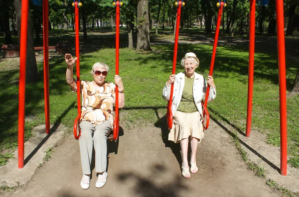 Two Mature Women Park Swing Summer — Stock Fotó