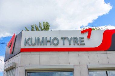 Kyiv, Ukraine - July 29, 2020: Tires sign on building - shop Kumho Tyre at Kyiv, Ukraine on July 29, 2020 clipart