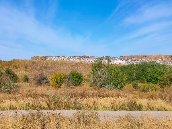Hill of diverse domestic garbage in landfill at Ukraine