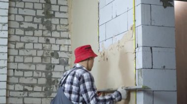 İnşaat cetvel ile gaz Beton taş duvara sıva yayılan Oluşturucu