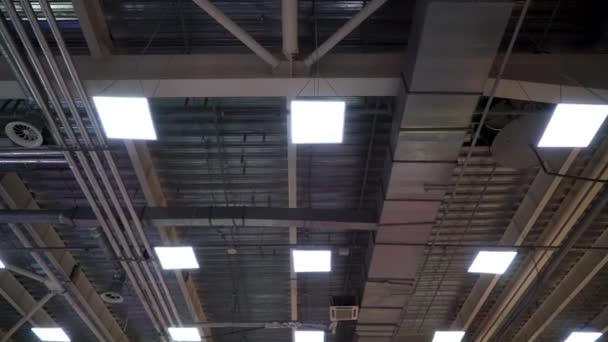 Air duct ventilation pipes on ceiling of big industrial building — Stock Video