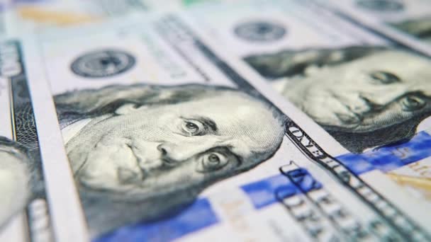 Macro of hundred dollar bills with portrait of Benjamin Franklin — Stock Video