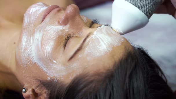 Woman getting facial massage with special equipment in wellness spa — Stock Video