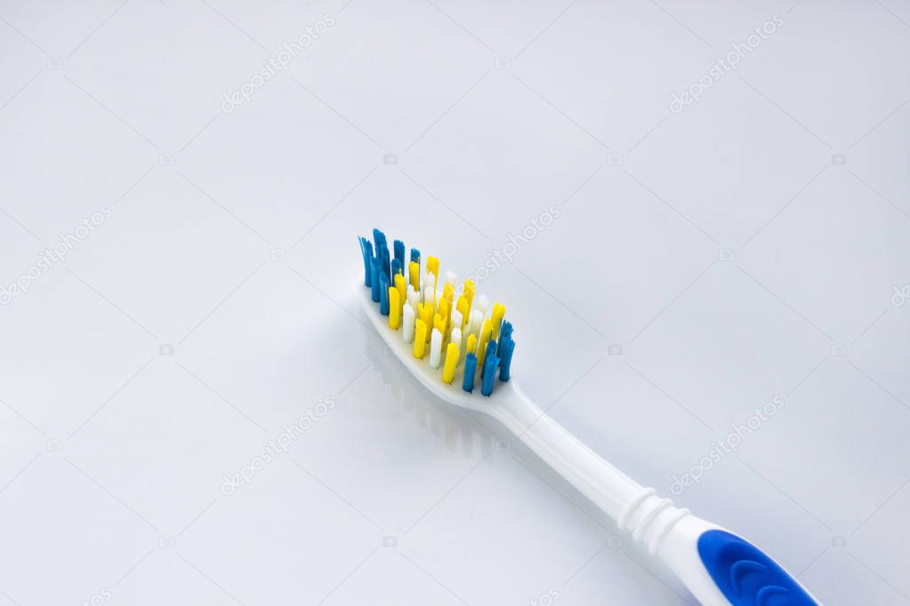 blue and white toothbrush on a white background