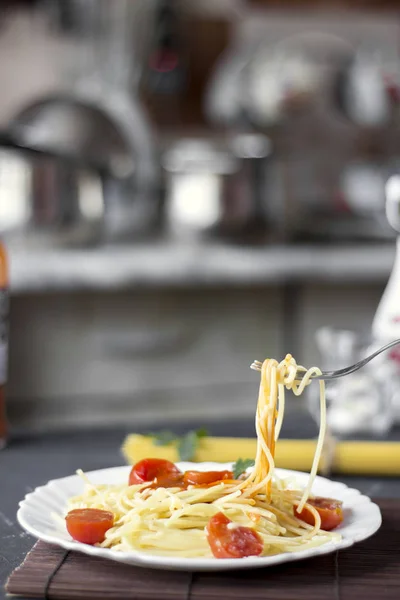 Spaghetti pasta in tomato sauce with cheese and parsley. Italian