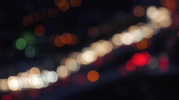 Defocused street lights. City blur background. Moving bokeh circles of night traffic — Stock Video