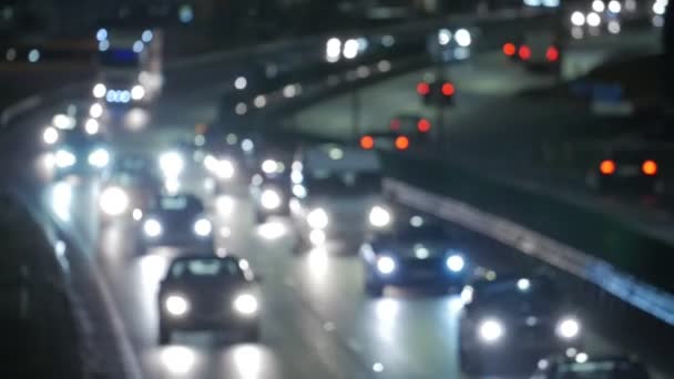 Bokeh Auto Licht in der Nacht. Ampel aus dem Fokus geraten. — Stockvideo