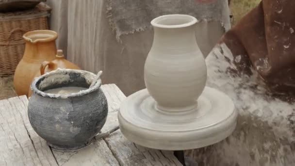 Artist potter in his workshop creating a ceramic pottery. Hands closeup. — Stock Video