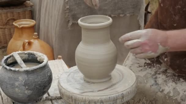 Artist potter in his workshop creating a ceramic pottery. Hands closeup. — Stock Video