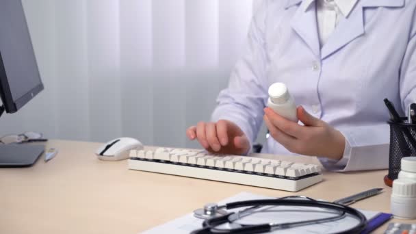 Doctor typing, keeping medical records, writing online prescription, consulting — Stock Video