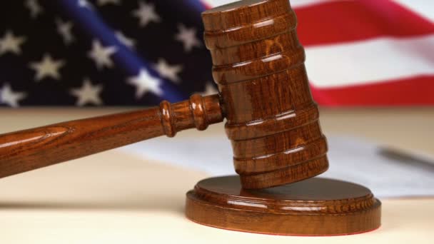 Judge gavel hammer against the US flag, american legal system, justice, law — Stock Video