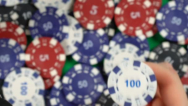 Gambler throwing poker chip up in the air, poker background, slow-motion — Stock Video