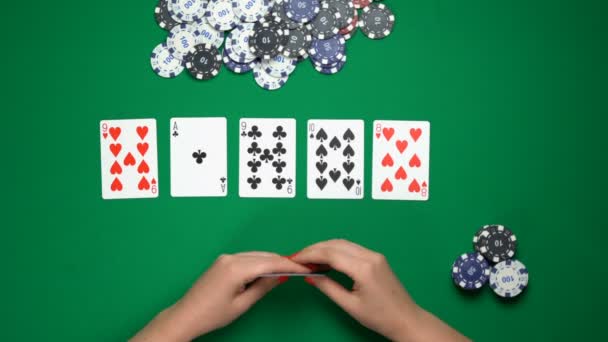 Poker player folding cards, weak hand, unsuccessful game, money loss. Top view — Stock Video