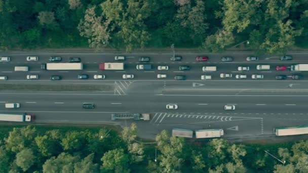Cars and trucks standing in traffic jam on modern highway transportation problem — Stock Video