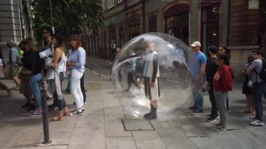 Porto, Portugal - June 03, 2019: An artistic performance in line for the Lello and Irmeo book store 